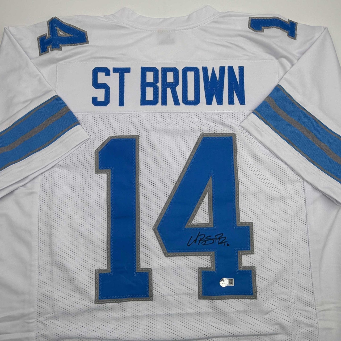 Autographed/Signed Amon-Ra St. Brown Detroit White Football Jersey Beckett BAS COA