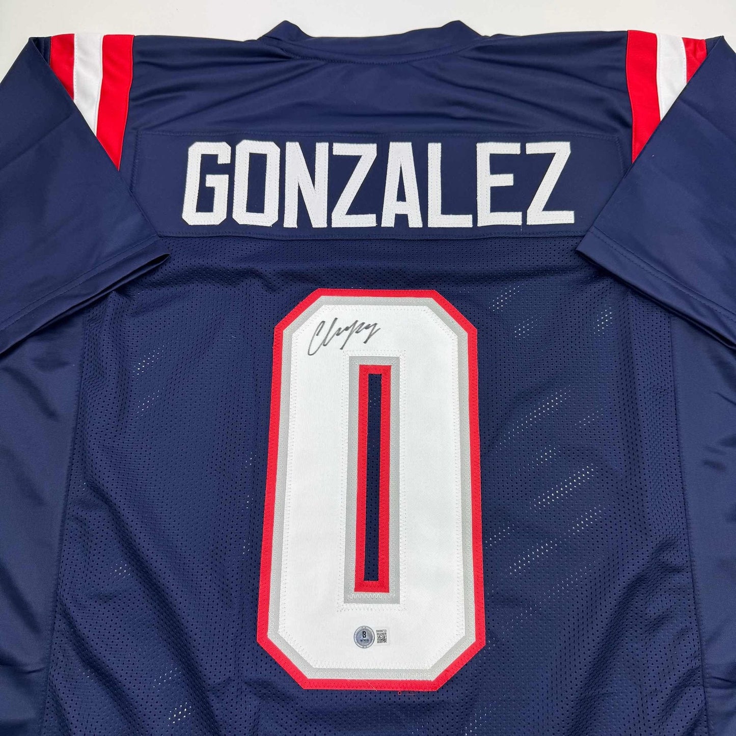 Autographed/Signed Christian Gonzalez New England Blue Football Jersey Beckett BAS COA