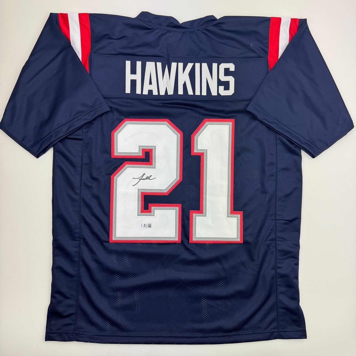 Autographed/Signed Jaylinn Hawkins New England Blue Football Jersey Beckett BAS COA