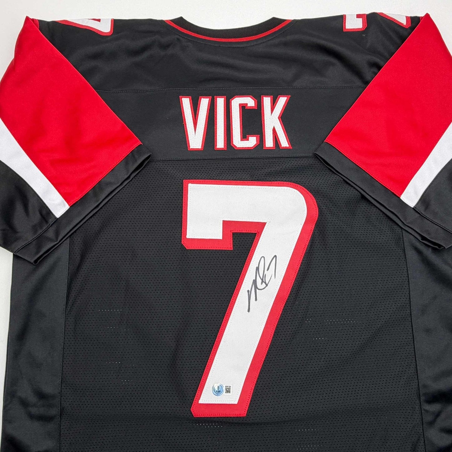 Autographed/Signed Michael Mike Vick Atlanta Black Football Jersey Beckett BAS COA