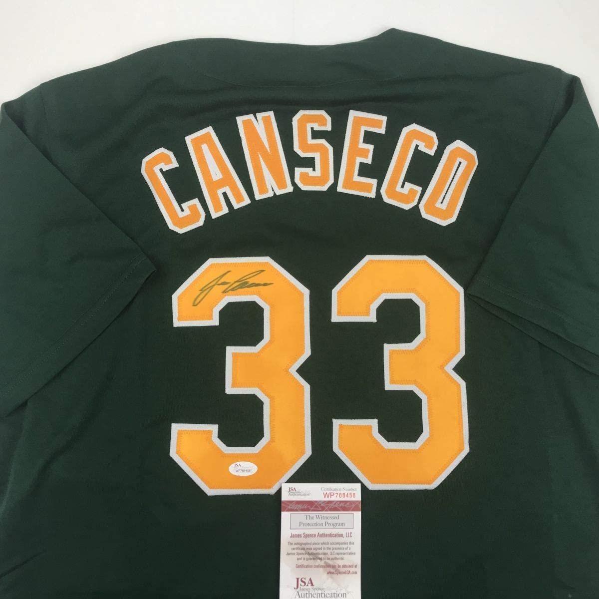 Autographed/Signed Jose Canseco Oakland Dark Green Baseball Jersey JSA COA