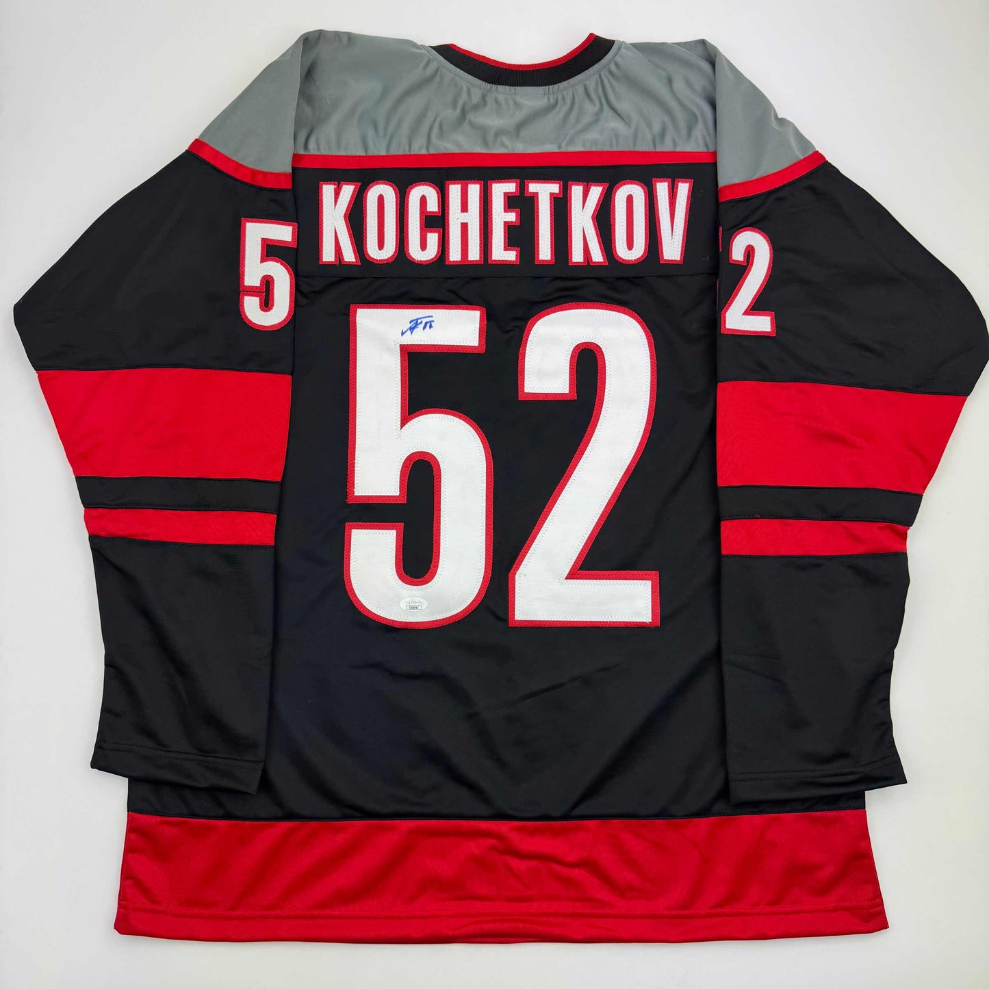 Autographed/Signed Pyotr Kochetkov Carolina Black Hockey Jersey JSA COA