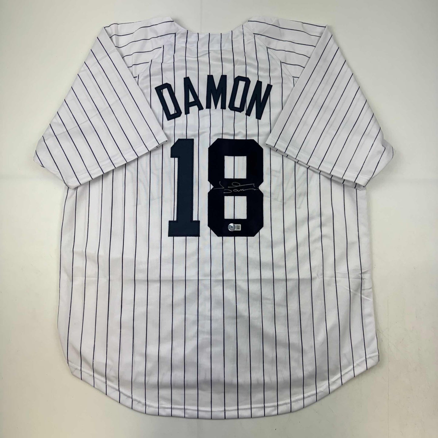 Autographed/Signed Johnny Damon New York Pinstripe Baseball Jersey Beckett BAS COA