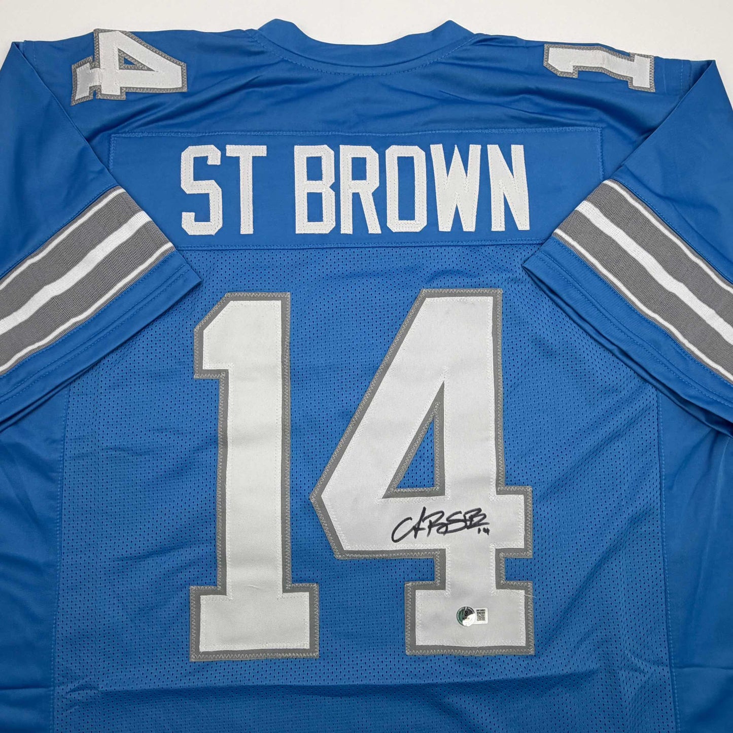 Autographed/Signed Amon-Ra St. Brown Detroit Current Blue Football Jersey Beckett BAS COA - Golden Apple Comics