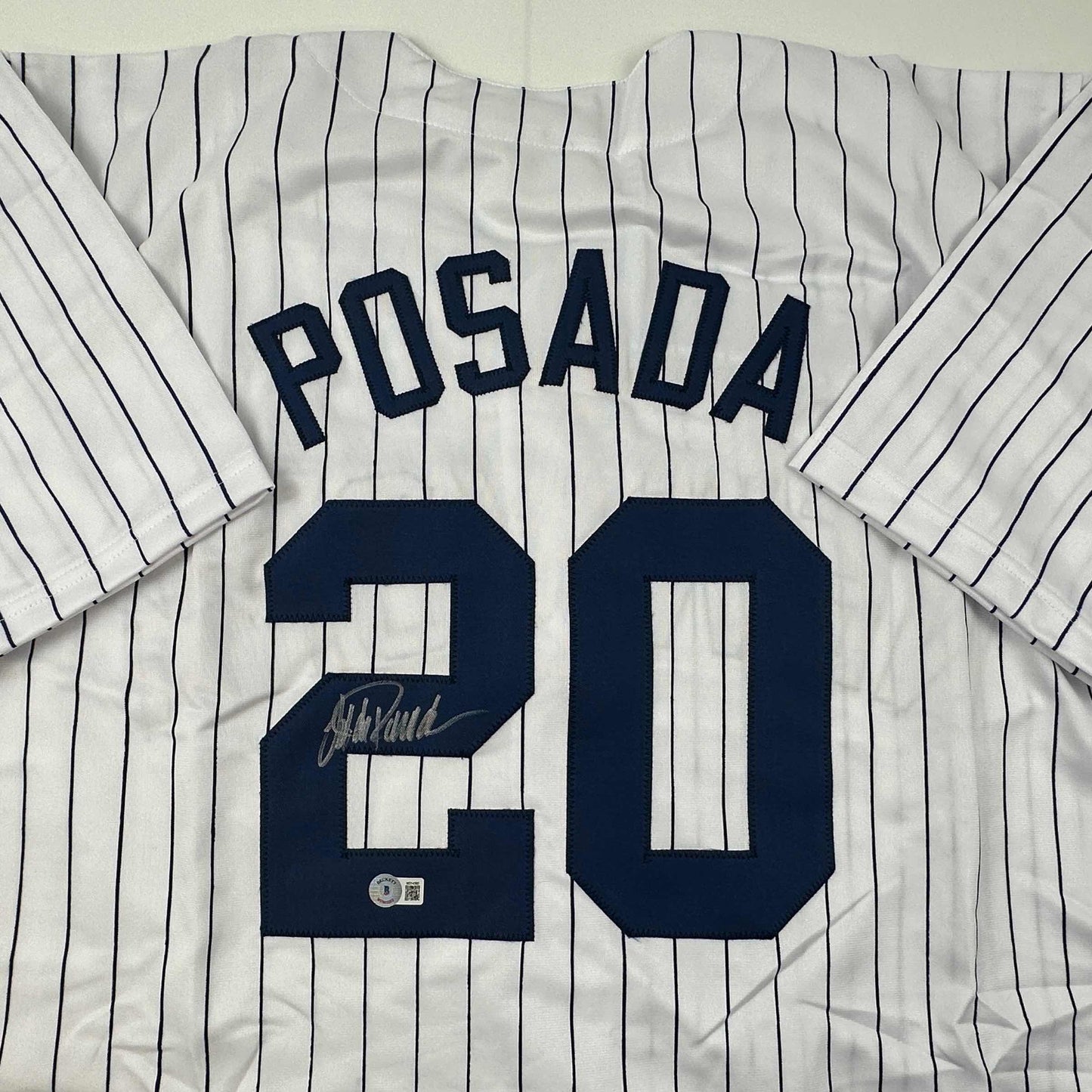 Autographed/Signed Jorge Posada New York Pinstripe Baseball Jersey Beckett BAS COA