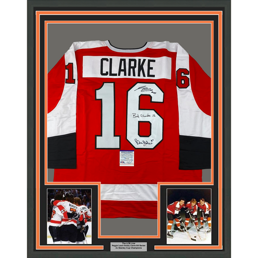 Framed Autographed/Signed LCB Line Reggie Leach, Bobby Clarke & Bill Barber 35x39 Philadelphia Orange Hockey Jersey JSA COA - Golden Apple Comics