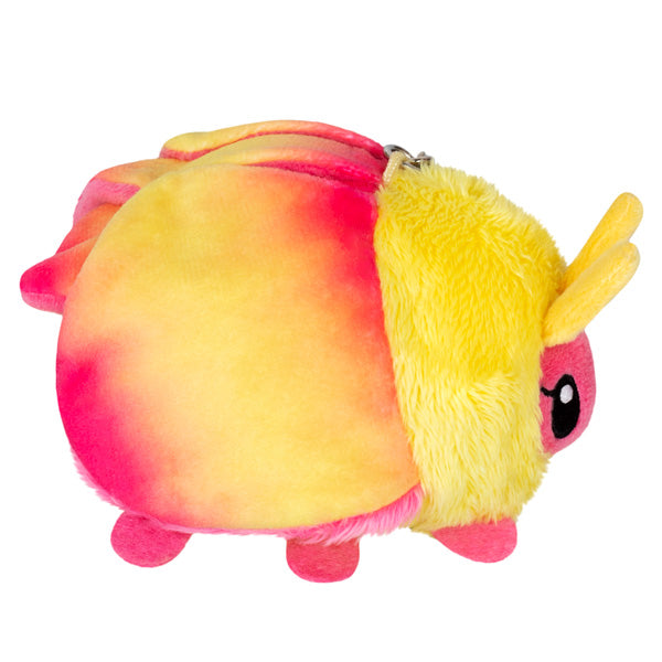 https://goldenapplecomics.com/cdn/shop/files/micro_rosy_maple_moth_side.jpg?v=1703525708&width=1445