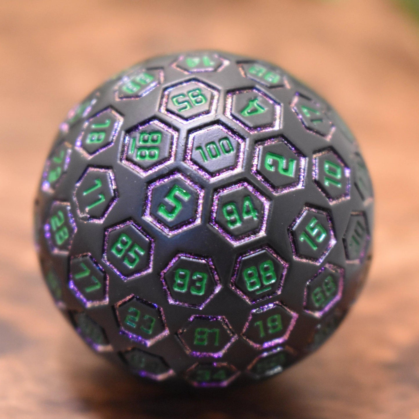 The Orb D100 -  Purple, Green, and Black Metal Die